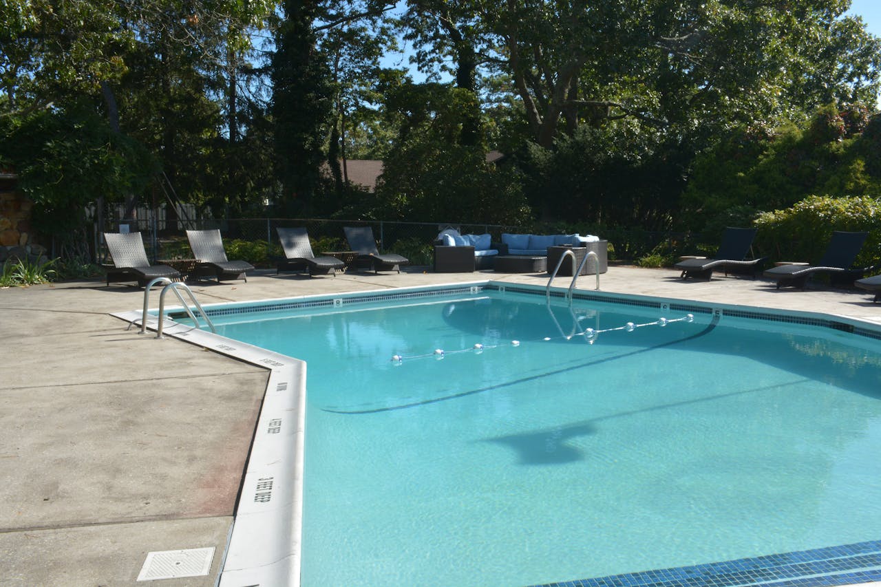 services-06 Discover relaxation at this luxurious outdoor poolside retreat in Hampton Bays, NY.