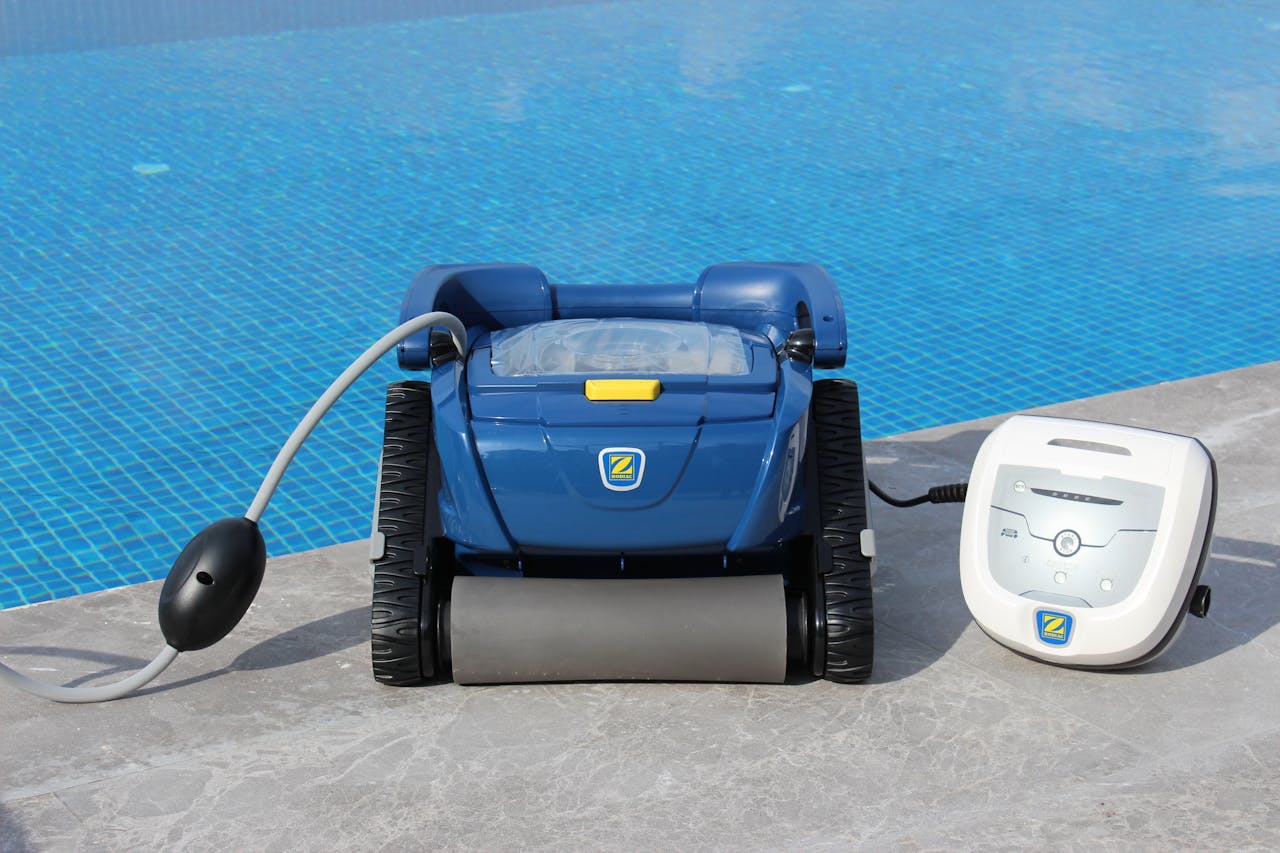 why-choose-us Robotic pool cleaner on pool edge in Bodrum, Turkey. Efficient and modern.