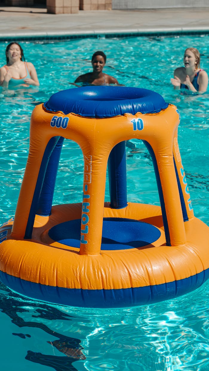 Mastering the First Impression: Your intriguing post title goes here A fun pool party scene with an inflatable basketball hoop, embodying summer leisure and activity.